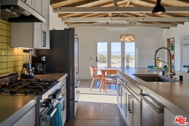 kitchen with wood ceiling, appliances with stainless steel finishes, sink, and white cabinets