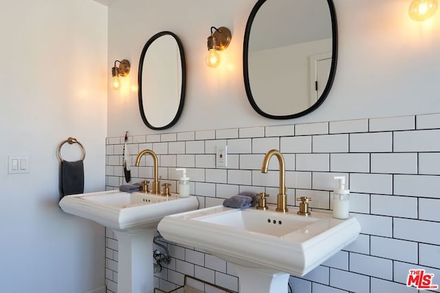 bathroom with tile walls and tasteful backsplash