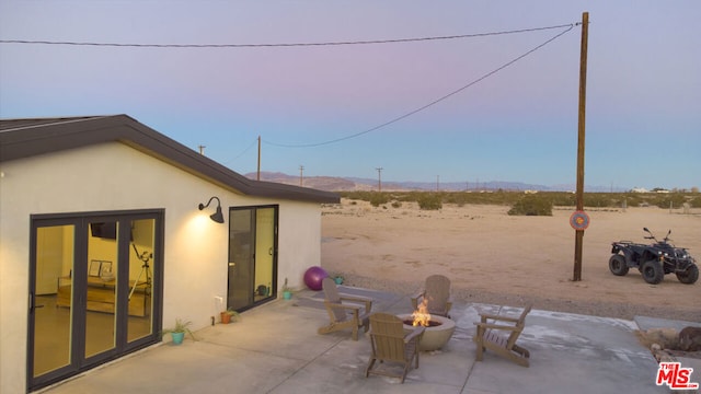 view of patio with an outdoor fire pit