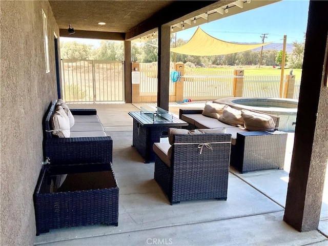 view of patio featuring an outdoor living space and fence