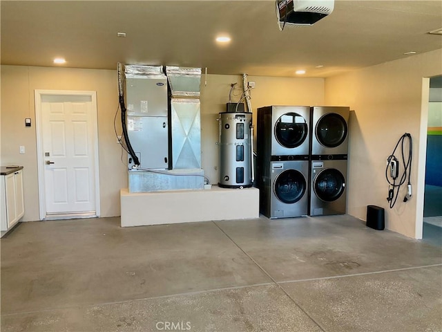 garage featuring recessed lighting, heating unit, stacked washer / drying machine, a garage door opener, and heat pump water heater