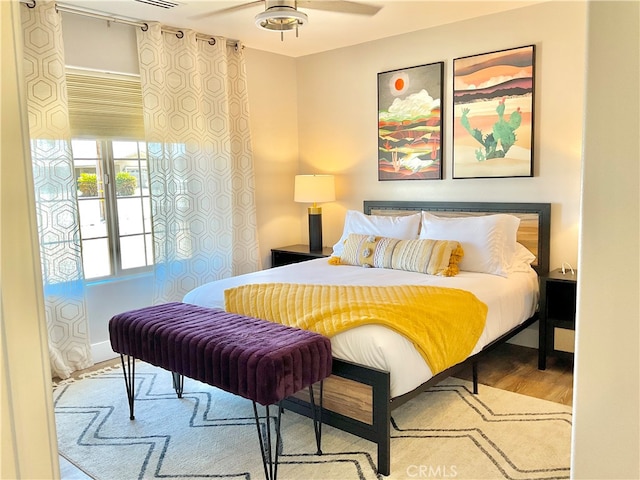 bedroom featuring light hardwood / wood-style floors and ceiling fan