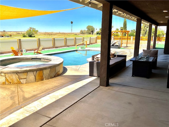 view of pool featuring an in ground hot tub and a patio area