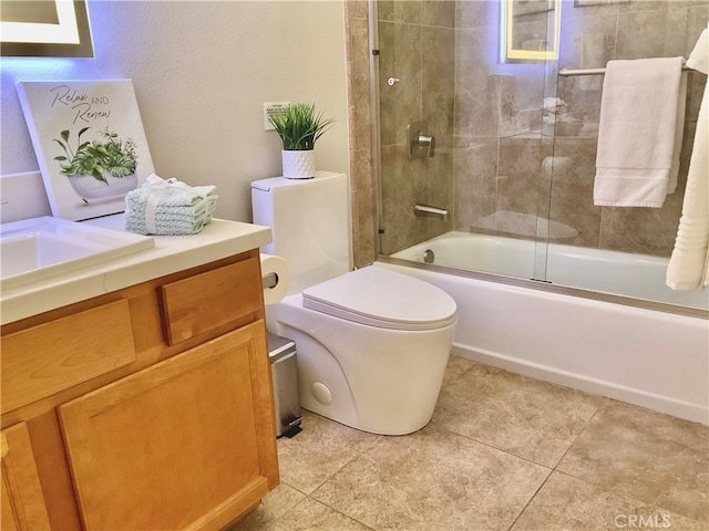 full bathroom with enclosed tub / shower combo, vanity, toilet, and tile patterned floors