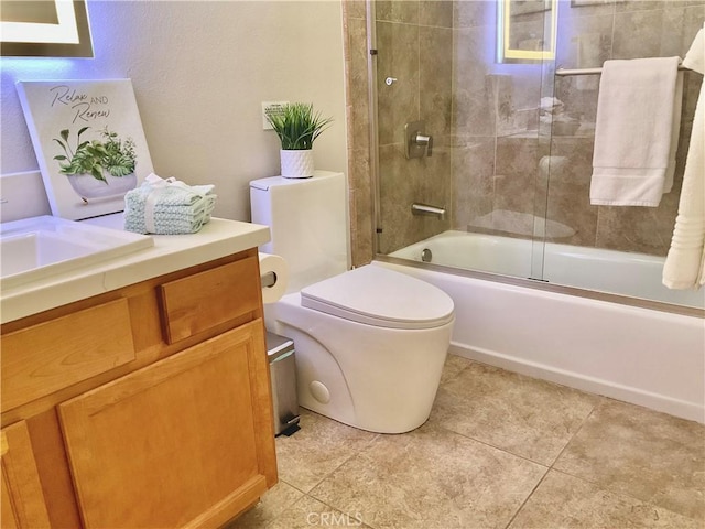 full bathroom with toilet, enclosed tub / shower combo, vanity, and tile patterned flooring