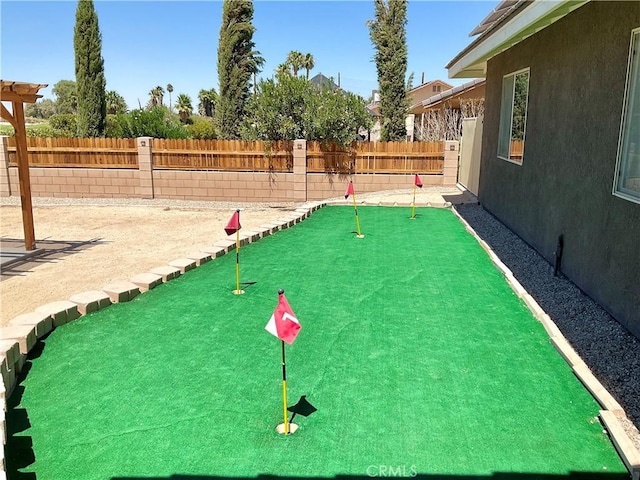 view of home's community with a fenced backyard