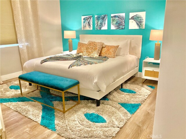 bedroom featuring wood-type flooring