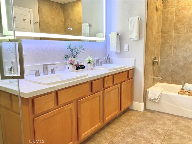 bathroom featuring tiled shower / bath combo, tile patterned flooring, and vanity