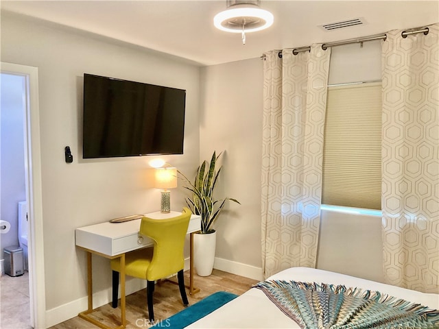 bedroom with light wood-type flooring