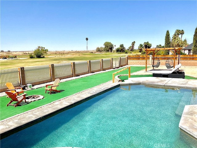 view of pool featuring a fire pit