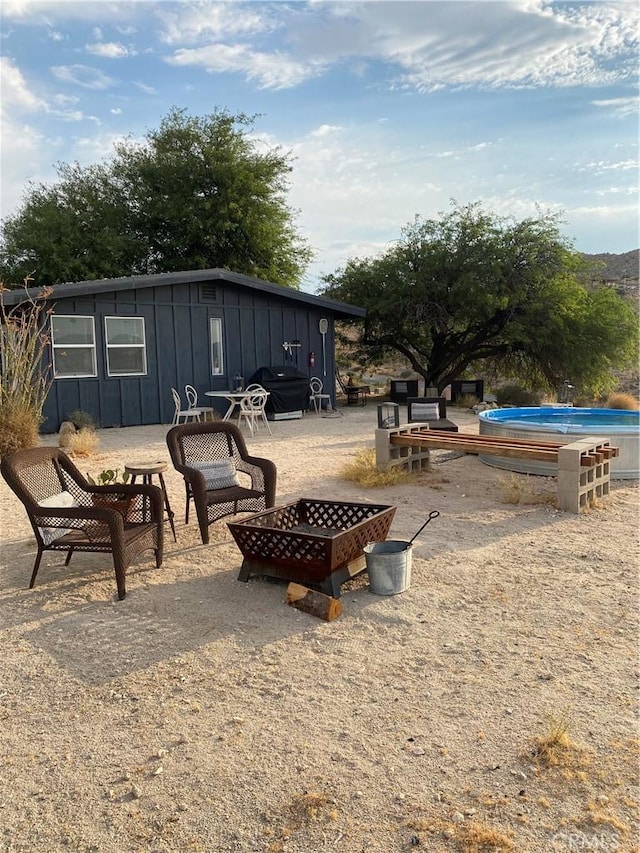 6161 Mirlo Rd, Yucca Valley, CA 92284 - view of patio / terrace featuring a fire pit