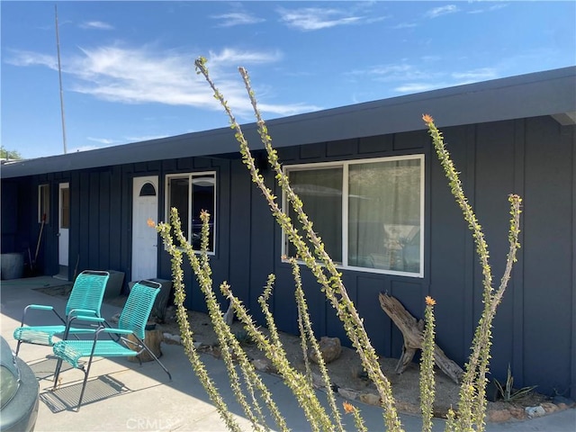 6161 Mirlo Rd, Yucca Valley, CA 92284 - exterior space with board and batten siding and a patio