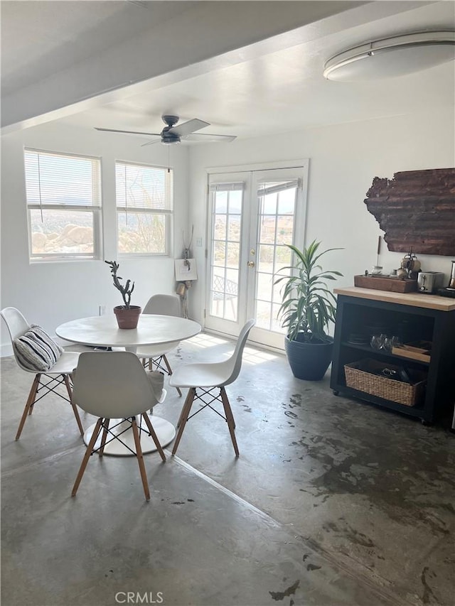 6161 Mirlo Rd, Yucca Valley, CA 92284 - dining area featuring french doors, a ceiling fan, and concrete floors