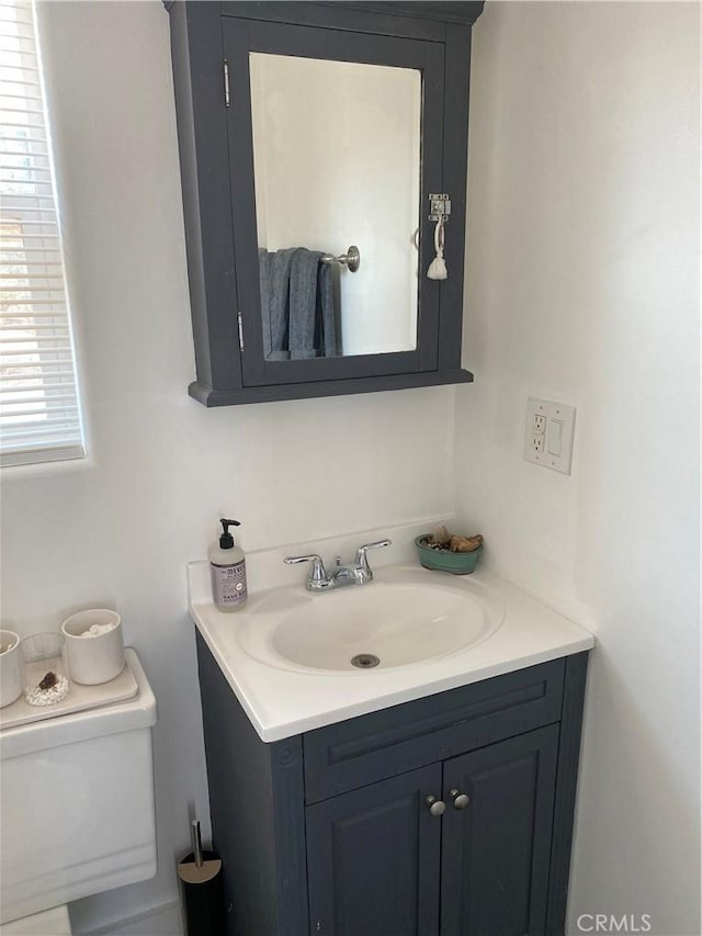 6161 Mirlo Rd, Yucca Valley, CA 92284 - half bathroom featuring vanity and toilet