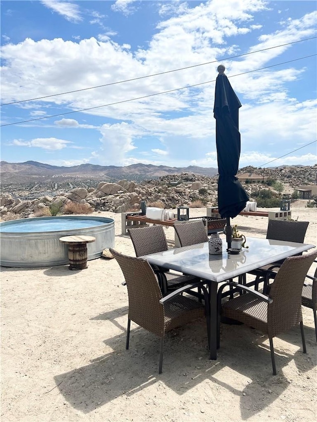 6161 Mirlo Rd, Yucca Valley, CA 92284 - view of patio / terrace with outdoor dining area and a mountain view