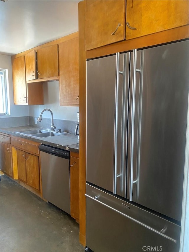 6161 Mirlo Rd, Yucca Valley, CA 92284 - kitchen with a sink, finished concrete flooring, stainless steel appliances, and brown cabinets