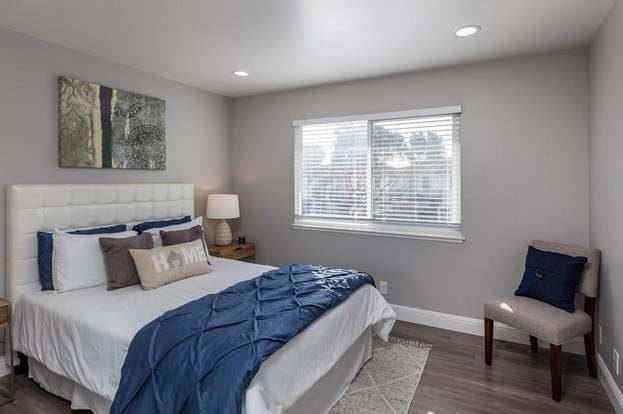 bedroom with wood-type flooring