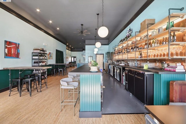 bar with crown molding, wood-type flooring, decorative light fixtures, and ceiling fan