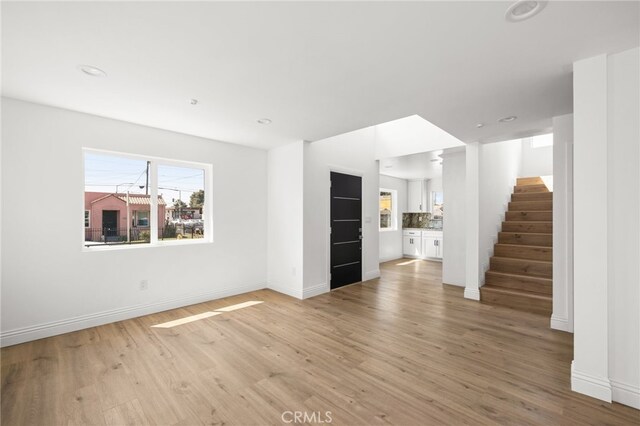 unfurnished living room featuring light hardwood / wood-style flooring