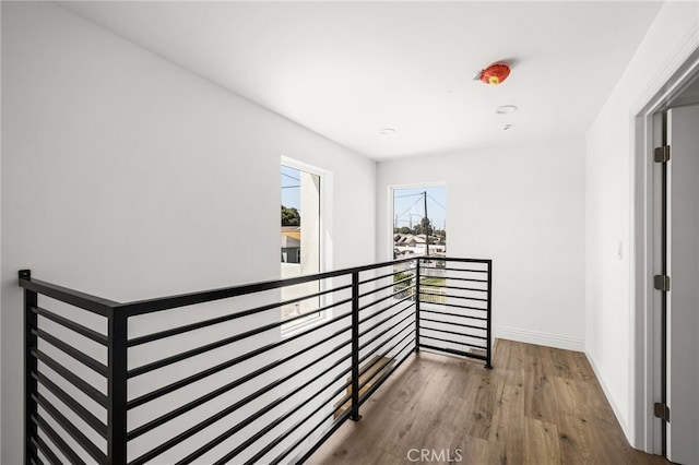 corridor featuring hardwood / wood-style floors