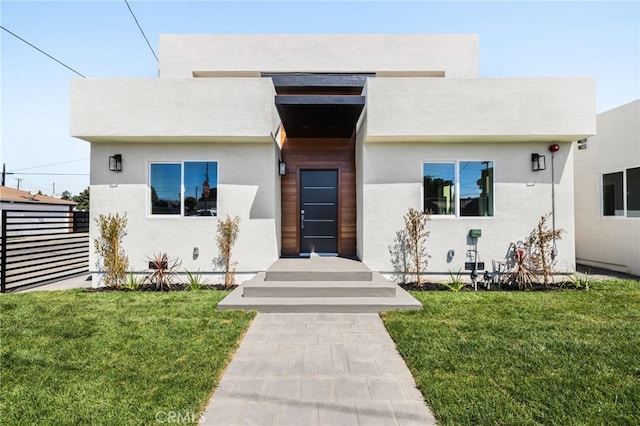 view of front of home with a front lawn