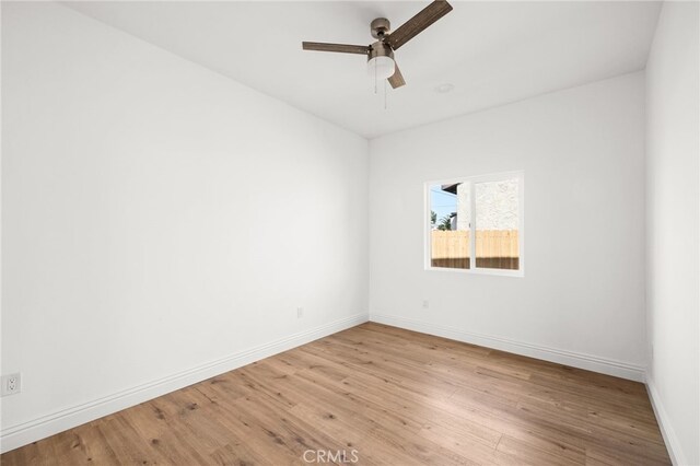 unfurnished room featuring ceiling fan and light hardwood / wood-style floors