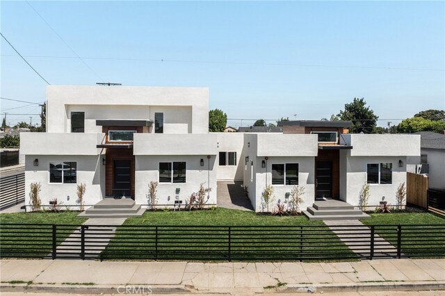 modern home featuring a front yard