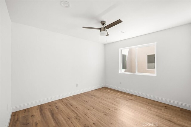 unfurnished room featuring ceiling fan and light hardwood / wood-style flooring