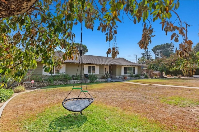 single story home featuring a front yard