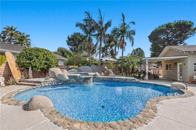 view of swimming pool with a patio