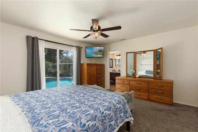 bedroom featuring connected bathroom, access to outside, dark carpet, and ceiling fan