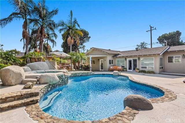 view of swimming pool featuring a patio area