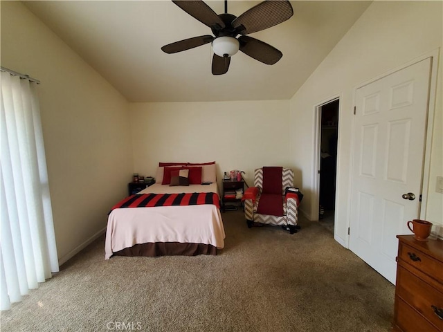 bedroom featuring ceiling fan, dark carpet, and lofted ceiling