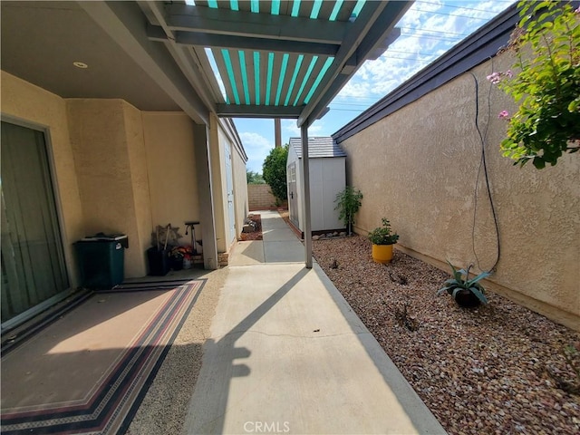 view of patio with a storage unit