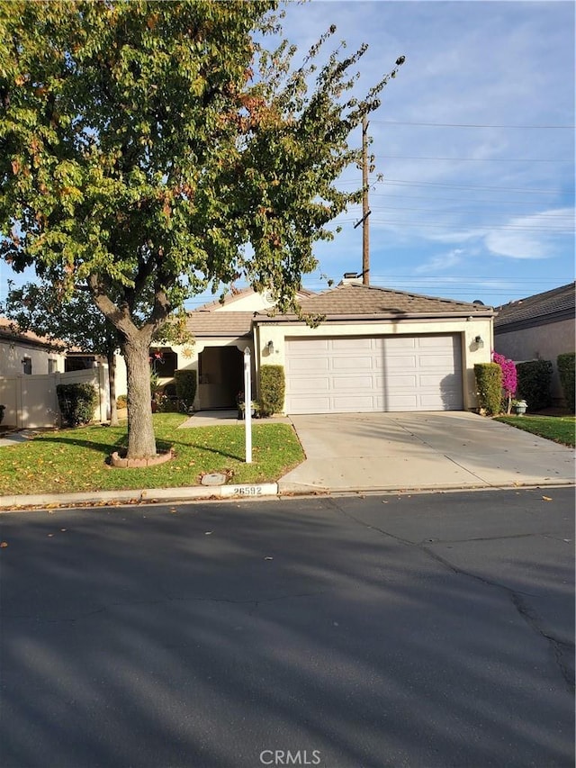 ranch-style home featuring a garage