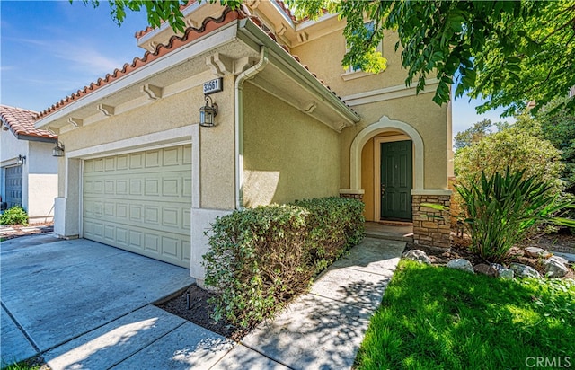 doorway to property featuring a garage