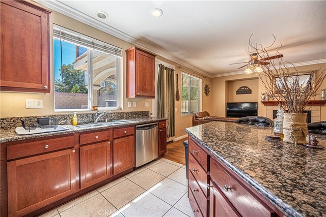 kitchen featuring crown molding, plenty of natural light, and stainless steel dishwasher