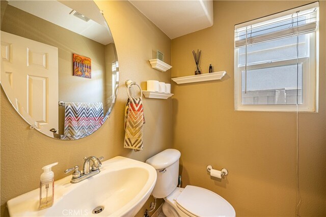 bathroom with sink and toilet