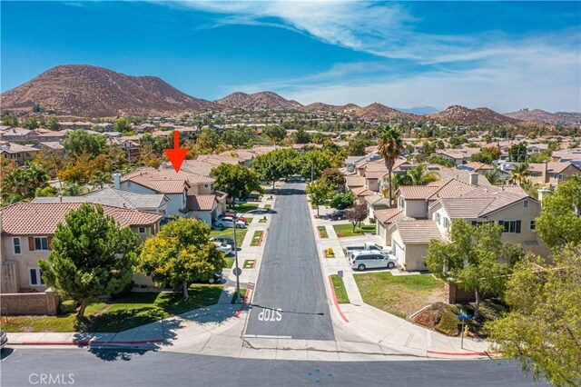 birds eye view of property with a mountain view