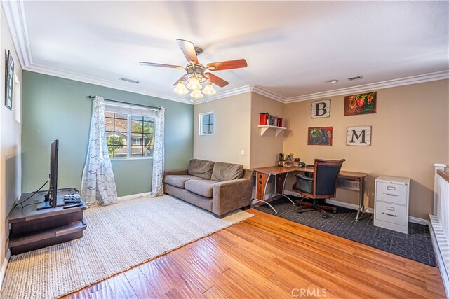 office space featuring ornamental molding, hardwood / wood-style floors, and ceiling fan