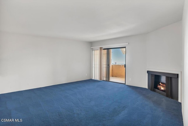 unfurnished living room featuring carpet