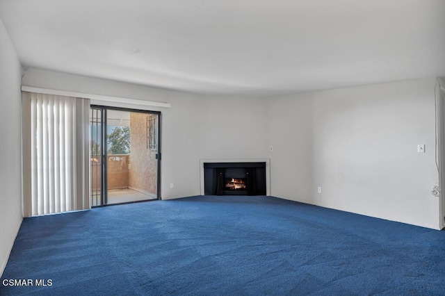 unfurnished living room featuring carpet flooring