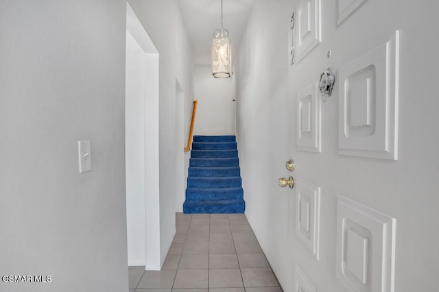 hall featuring light tile patterned floors