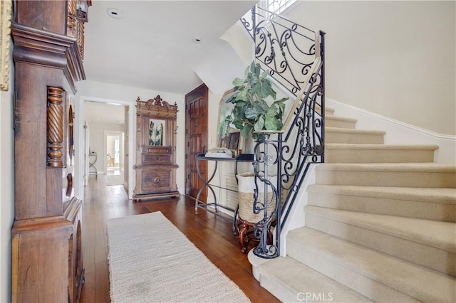 entryway featuring a healthy amount of sunlight and dark hardwood / wood-style floors