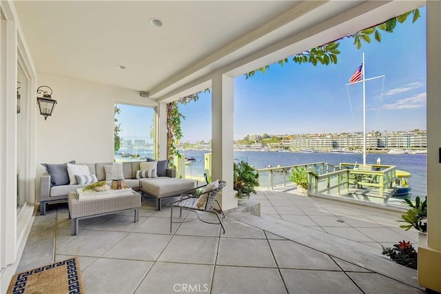 view of patio / terrace featuring a water view and outdoor lounge area