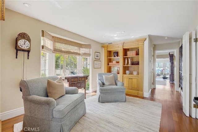 sitting room featuring wood-type flooring