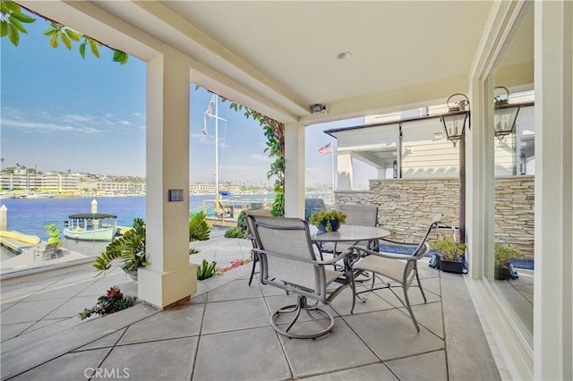 view of patio / terrace with a water view