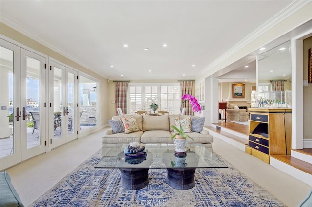 living room with carpet, french doors, and crown molding