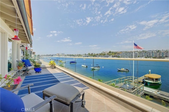 balcony featuring a water view