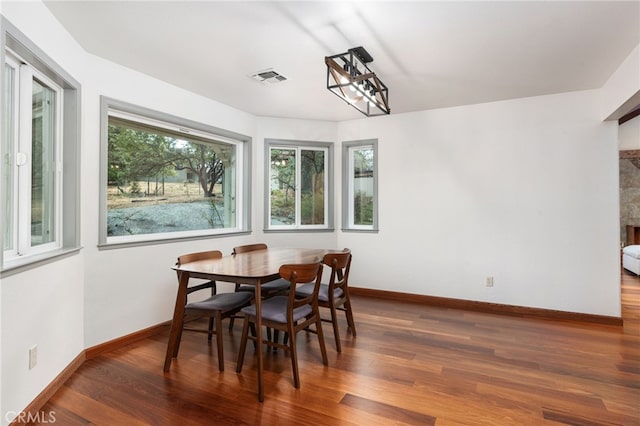 dining area featuring dark hardwood / wood-style floors